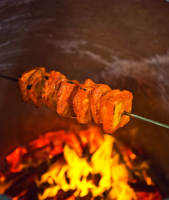 Smoky and tender paneer tikka skewers, perfect as appetizers for festive corporate Christmas parties