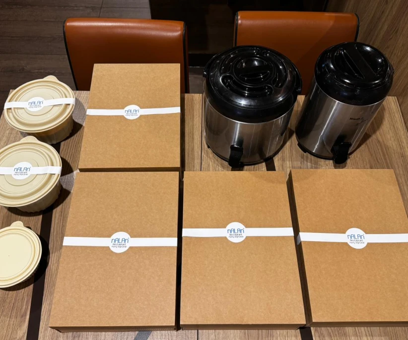 Packed Indian high tea catering items in Singapore with savoury snacks and sweets for office meetings and gatherings.