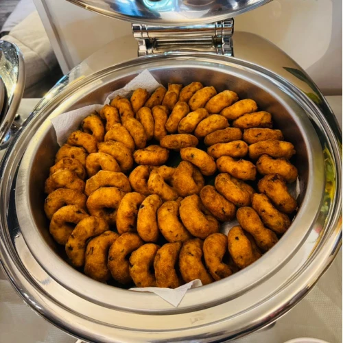 Indian high tea catering in Singapore for home parties and family gatherings, with snacks, sweets and refreshing drinks.